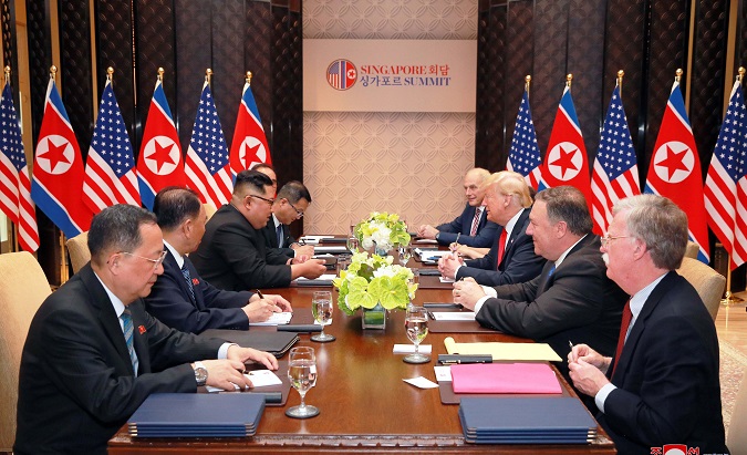 U.S. President Donald Trump and North Korea's leader Kim Jong Un attend a meeting in Singapore. June 11, 2018