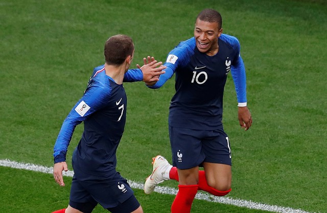 France's Kylian Mbappe celebrates scoring their first goal with Antoine Griezmann.