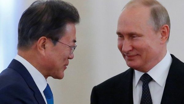 South Korea's President Moon Jae-in (L) meets with his Russian counterpart Vladimir Putin in the Kremlin.