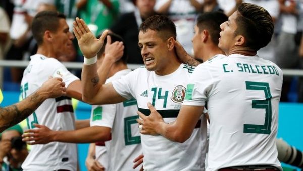 Mexico's Javier Hernandez celebrates scoring their second goal with Carlos Salcedo and teammates. 