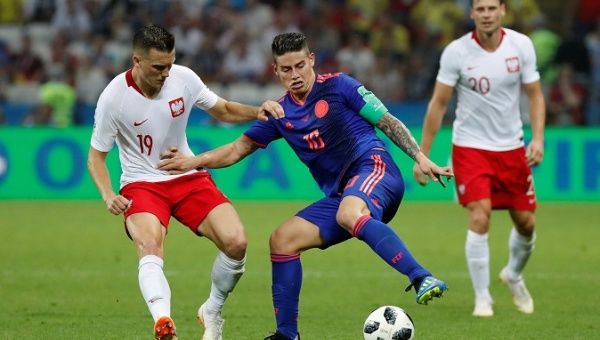 Soccer Football - World Cup - Group H - Poland vs Colombia - Kazan Arena, Kazan, Russia - June 24, 2018 Colombia's James Rodriguez in action with Poland's Piotr Zielinski