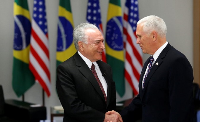 Brazil's un-elected president Michel Temer (l) greets U.S. VP Mike Pence.