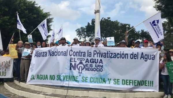 At least 50 organizations and the FMLN, march in the streets of San Salvador demonstrating against water privatization legislation in late June, 2018.