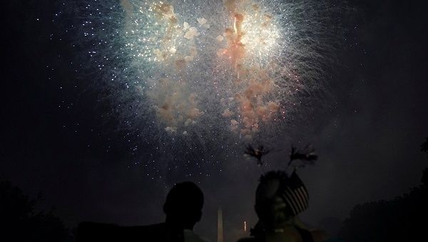 People watch fireworks during the 4th of July U.S. Independence Day celebrations at the National Mall in Washington, D.C.