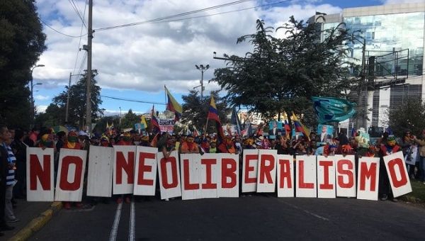 Protesters reject neoliberal reforms and show their support for Rafael Correa.