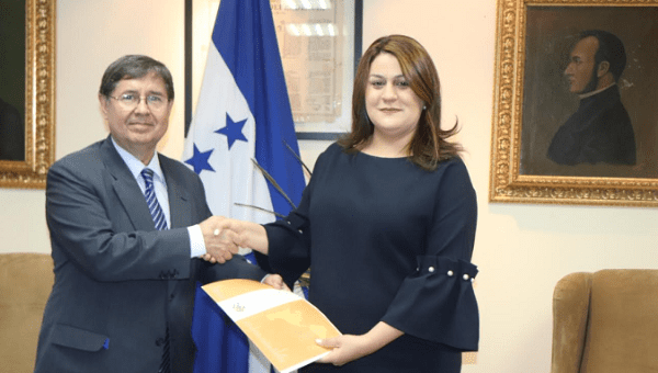 The new head of the Mission Against Corruption and Impunity in Honduras, Luiz Antonio Marrey Guimaraes (L), is sworn in.