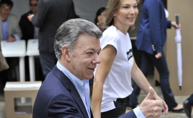 Colombia's President Juan Manuel Santos and his wife Maria Clemencia Rodriguez Munera casting his vote at a polling station during the second round of the presidential election in Bogota, Colombia, June 17, 2018.