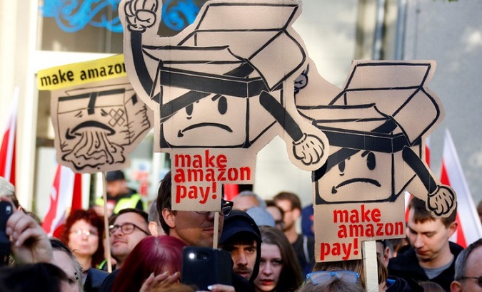 Amazon workers and activists protest ahead of the annual Axel Springer award ceremony in Berlin.