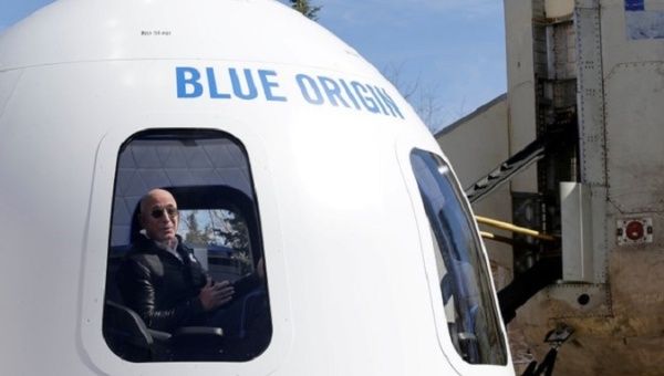 Amazon and Blue Origin founder Jeff Bezos addresses the media about the New Shepard rocket booster.