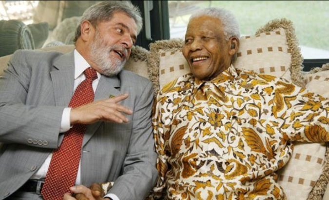 Former Brazilian President Luiz Inacio Lula da Silva and South African President Nelson Mandela.