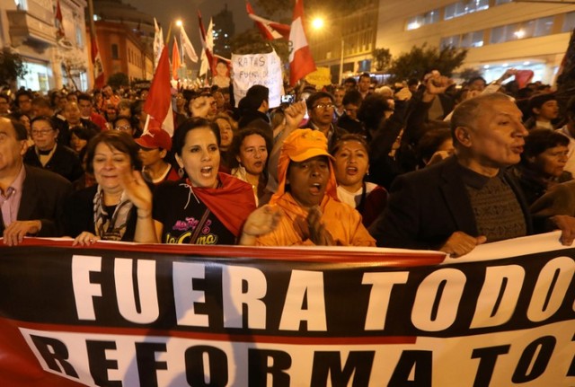 People protest against corruption, following an influence-peddling scandal that has shaken the country's justice system, in Lima, Peru.