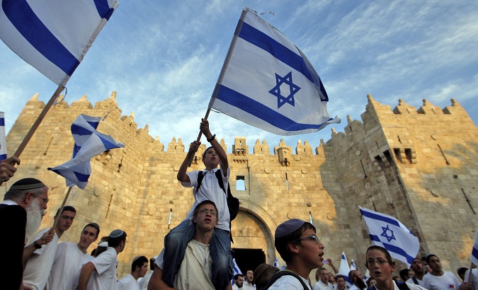 Israelis celebrate flag day in front of Damascus Gate, in occupied East Jerusalem.