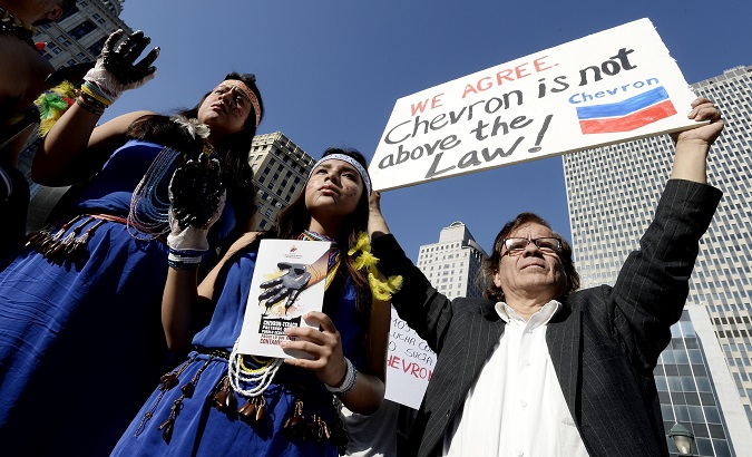 Indigenous women and international allies demand corporate accountability outside a New York City Court.