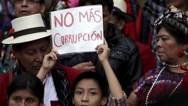 People march against corruption in the Central American country. 