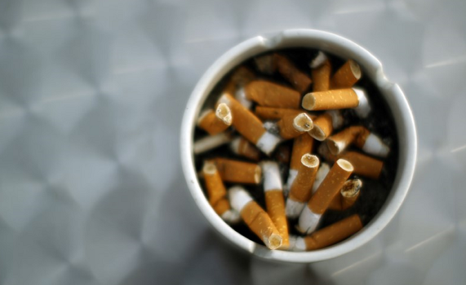An ash tray with cigarette butts in Hinzenbach, Austria, February 5, 2012