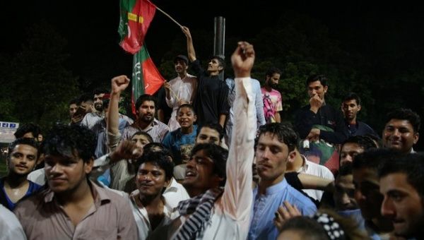 Supporters of Imran Khan political party celebrate during the general election in Islamabad, Pakistan.