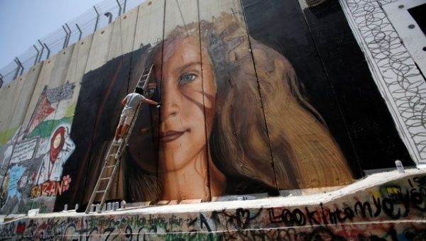  Ahed's family and Palestinian activists were preparing for her release with events and murals on the Israeli separation wall.