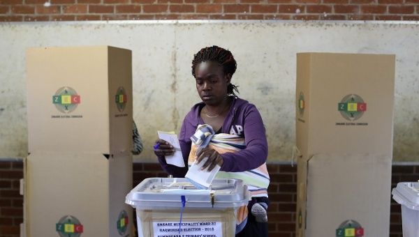 A Zimbabwean woman casts her ballot in the country's general elections in Harare, Zimbabwe, July 30, 2018.
