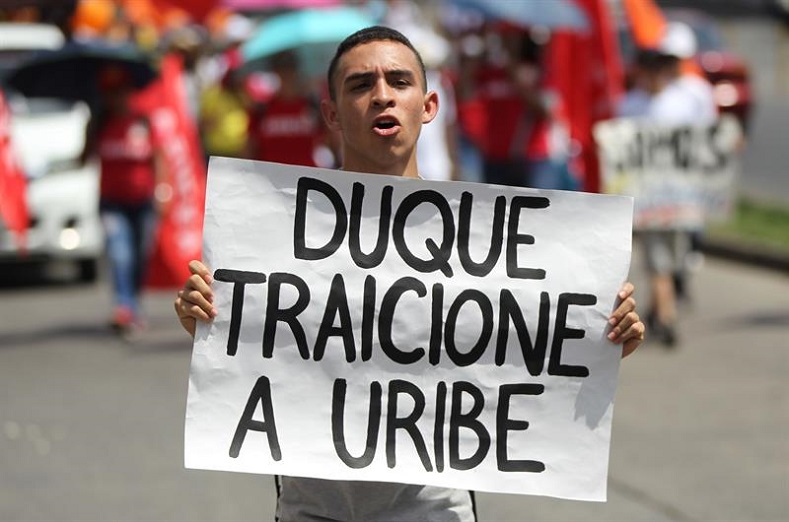 Many consider Ivan Duque a frontman for former right-wing Colombian President Alvaro Uribe, who's currently being investigated for witness tampering in a case linked to paramilitaries. 