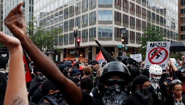 Antifascists, opponents of a white nationalist-led rally 'Unite the Right 2' rally, gather in downtown Washington, U.S., August 12, 2018