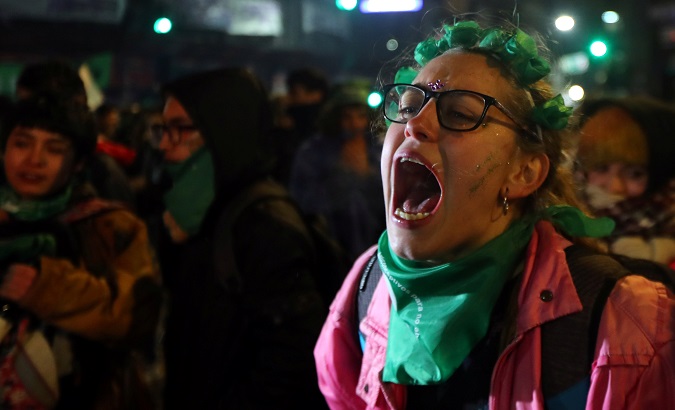 A woman reacts outside Congress after senators rejected a bill to legalize abortion in Buenos Aires, Argentina, August 2018.