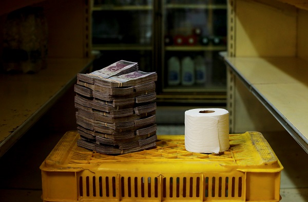 A toilet roll next to 2,600,000 bolivars, its price and the equivalent of US$0.40 at a mini-market in Caracas.