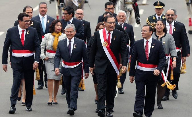 Peru's President Martin Vizcarra (2nd R) accompanied by his cabinet walks to the Congress during celebrations of Independence Day in Lima, Peru July 28, 2018