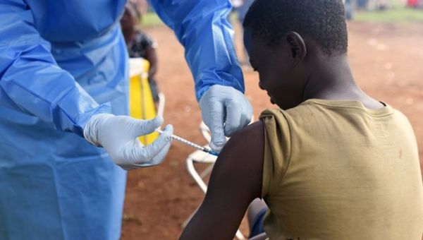  Congolese health worker administers Ebola vaccine to a boy who had contact with an Ebola sufferer in the village of Mangina in North Kivu province of the Democratic Republic of Congo.