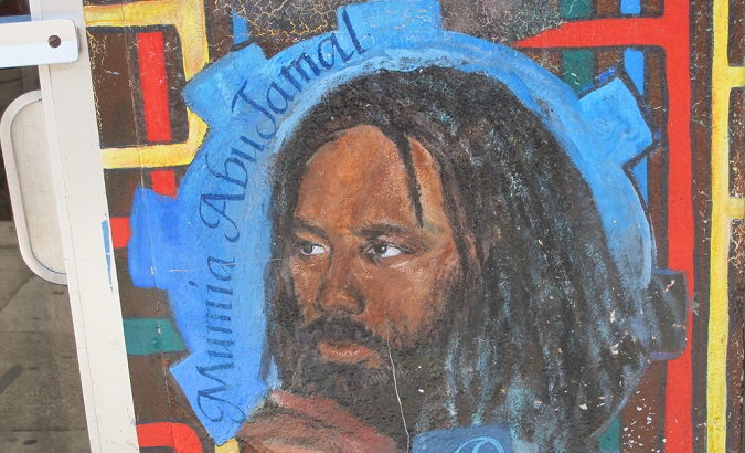 A mural depicting imprisoned Black Panther Party member Mumia Abu-Jamal.