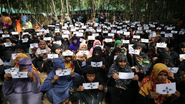 Women refugees demonstrate to demand justice for Myanmar's state violence. 