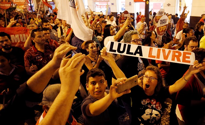 Supporters of Brazil's former President Luiz Inacio Lula da Silva attend a rally in Curitiba, August 30, 2018.