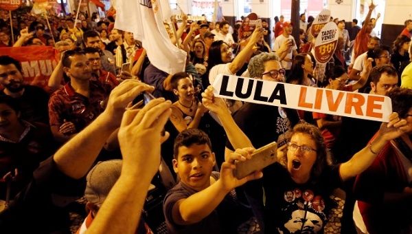 Supporters of Brazil's former President Luiz Inacio Lula da Silva attend a rally in Curitiba, August 30, 2018.