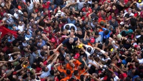 Former Brazilian President Lula is carried by supporters.