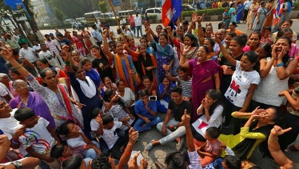 Members of the Dalit community shout slogans as they block a road during a protest in Mumbai, India, Jan. 3, 2018.