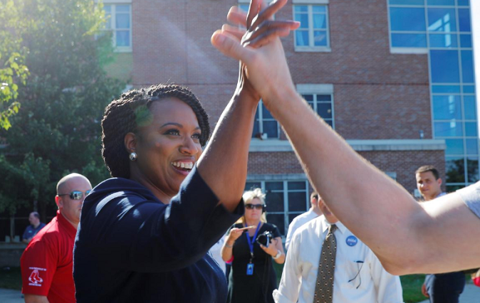 Democratic U.S Congressional candidate and Boston City Councilor Ayanna Pressley greets voters outside a polling station in Boston, Massachusetts, September 4, 2018.