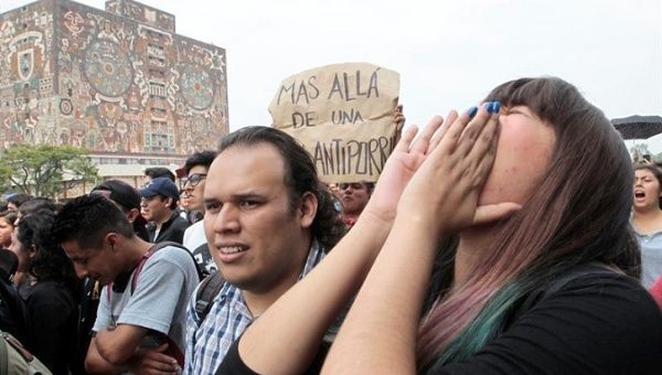 Thousands of UNAM students marched August 50 to protest violent attacks by mercenary shock groups known as 'porros.'