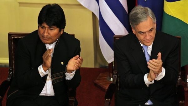 Bolivian President Evo Morales (L) said the ruling will be a chance for to “rewrite history” while President Sebastian Piñera (R) continues to defend his nation's past policies.