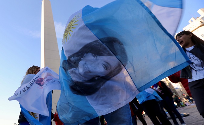 A supporter of former Argentine President Cristina Fernandez de Kirchner waves an Argentine flag with her image during a demonstration in Buenos Aires, Argentina August 28, 2018.