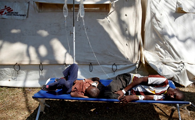 Patients await treatment at a makeshift cholera clinic in Harare, Zimbabwe, Sept. 11, 2018