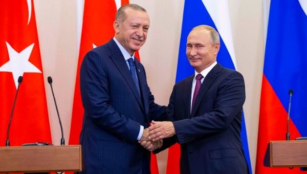 Russian President Vladimir Putin and his Turkish counterpart Tayyip Erdogan shake hands during a news conference in Sochi, Russia Sept. 17, 2018.