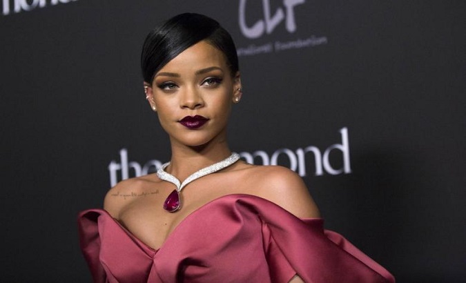 Singer Rihanna poses at the First Annual Diamond Ball fundraising event at The Vineyard in Beverly Hills, California Dec.11, 2014.
