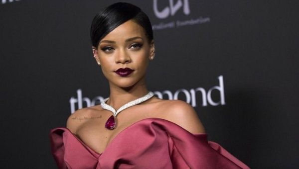 Singer Rihanna poses at the First Annual Diamond Ball fundraising event at The Vineyard in Beverly Hills, California Dec.11, 2014. 