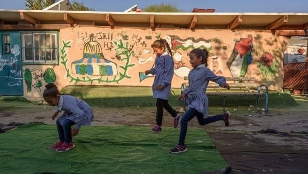 Children play in the Khan al-Ahmar school, which serves 170 Bedouin children.
