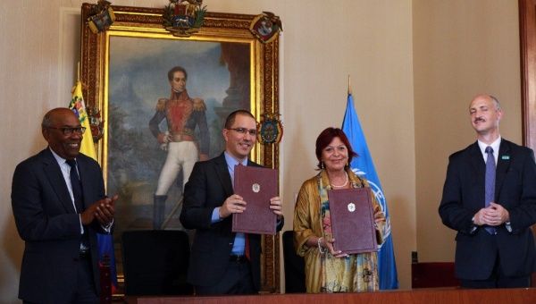 Jorge Arreaza, Venezuela's Foreign Minister, and Aristobulo Isturiz, the country's Minister of Communes and Social Protection, were on hand for the signing of the agreement with Perceval.