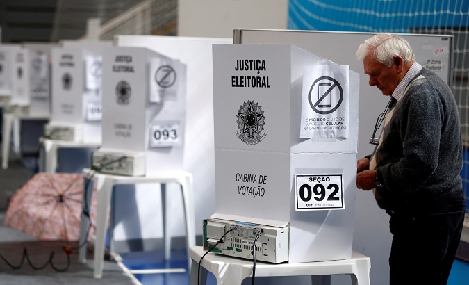 A man casts his vote during the presidential election in Curitiba, Brazil Oct. 7, 2018.