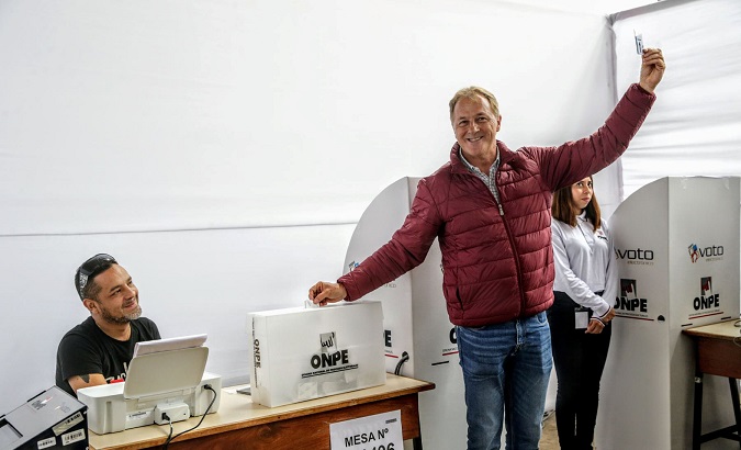 Lima's mayoral candidate from the Popular Action party Jorge Munoz casts his vote during Peruvian municipal and regional elections in Lima