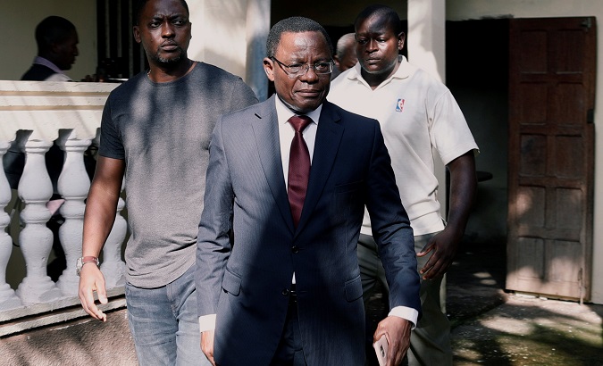 Maurice Kamto of Renaissance Movement (MRC) walks out after his news conference at his headquarters in Yaounde, Cameroon Oct.8, 2018.
