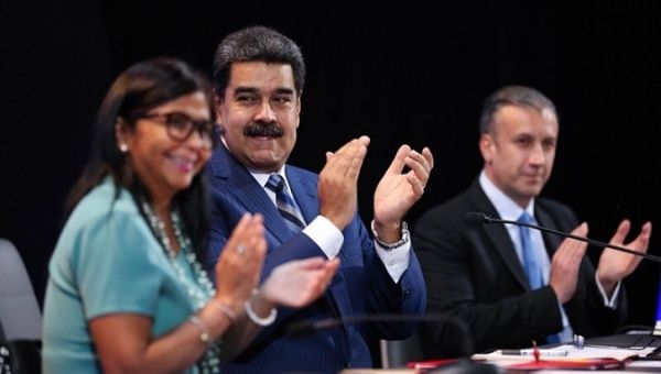 President Nicolas Maduro announces his plan during a meeting with workers along with senior officials of his government. 
