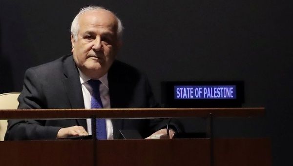 Palestinian U.N. Ambassador Riyad Mansour sits while members of the General Assembly vote on allowing Palestine to act like a member state in 2019 meetings.
