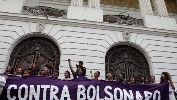 People demonstrate against presidential candidate Jair Bolsonaro in Rio de Janeiro. 